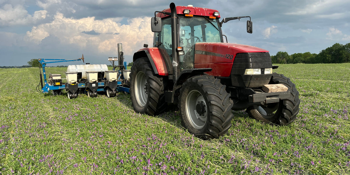 A photo of a tractor and planter. Photo Credit: Mac Kincaid