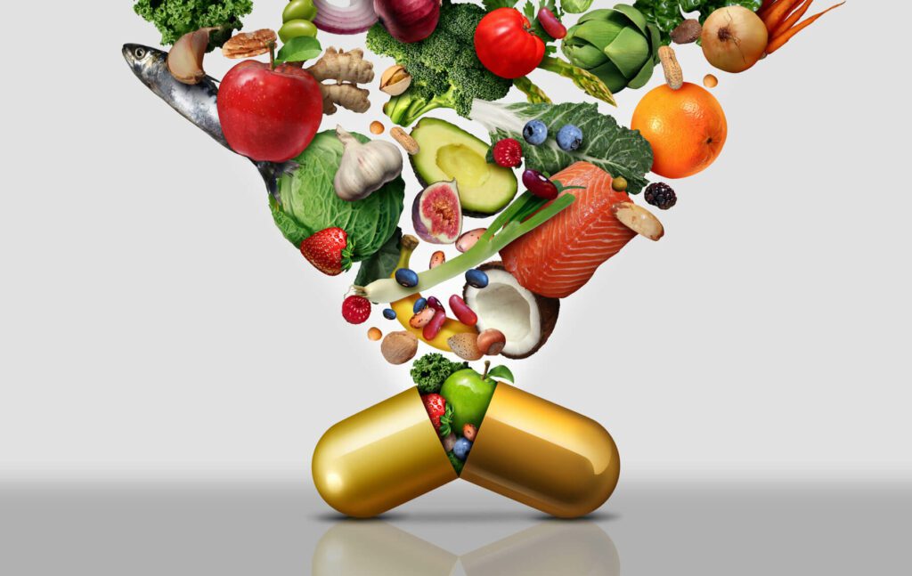 A golden pill capsule filled with healthy fruits, vegetables, and healthy proteins like fish demonstrating a way to improve human health