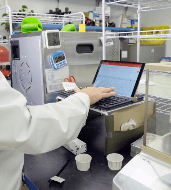Picture of a scientist analyzing results on a computer monitor in the bionutrient lab.